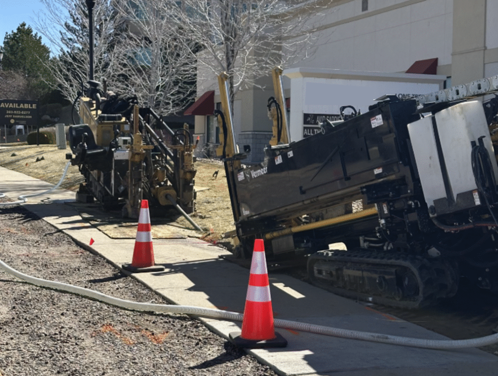 Two Trace Fiber Vermeer horizontal directional drills installing telecom OSP fiber conduit in Metro Denver, Colorado