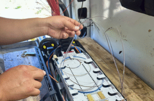 Splicing Ribbon fiber optic cable during an OSP network damage response in Denver Colorado
